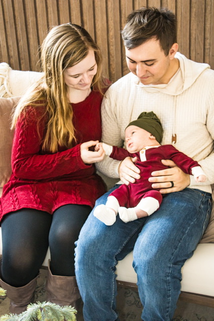 portrait of a husband and wife doting over newborn baby copyright Takyi Taylor Marketing, LLC, LT² Photography and LaDonna Takyi Taylor